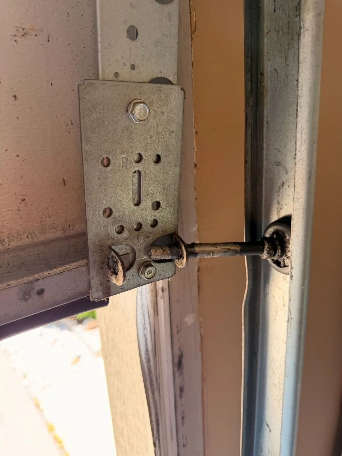 Old garage door roller that came out of its track and caused the garage door to go off track