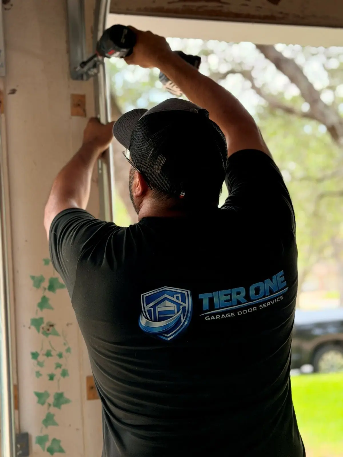 Tier One technician securing a track bracket